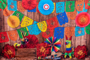 Mexican fiesta table decoration with vibrant colors and papel picado